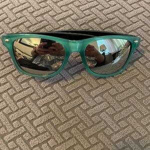 New plastic fashion sunglasses. Teal and black checkered design